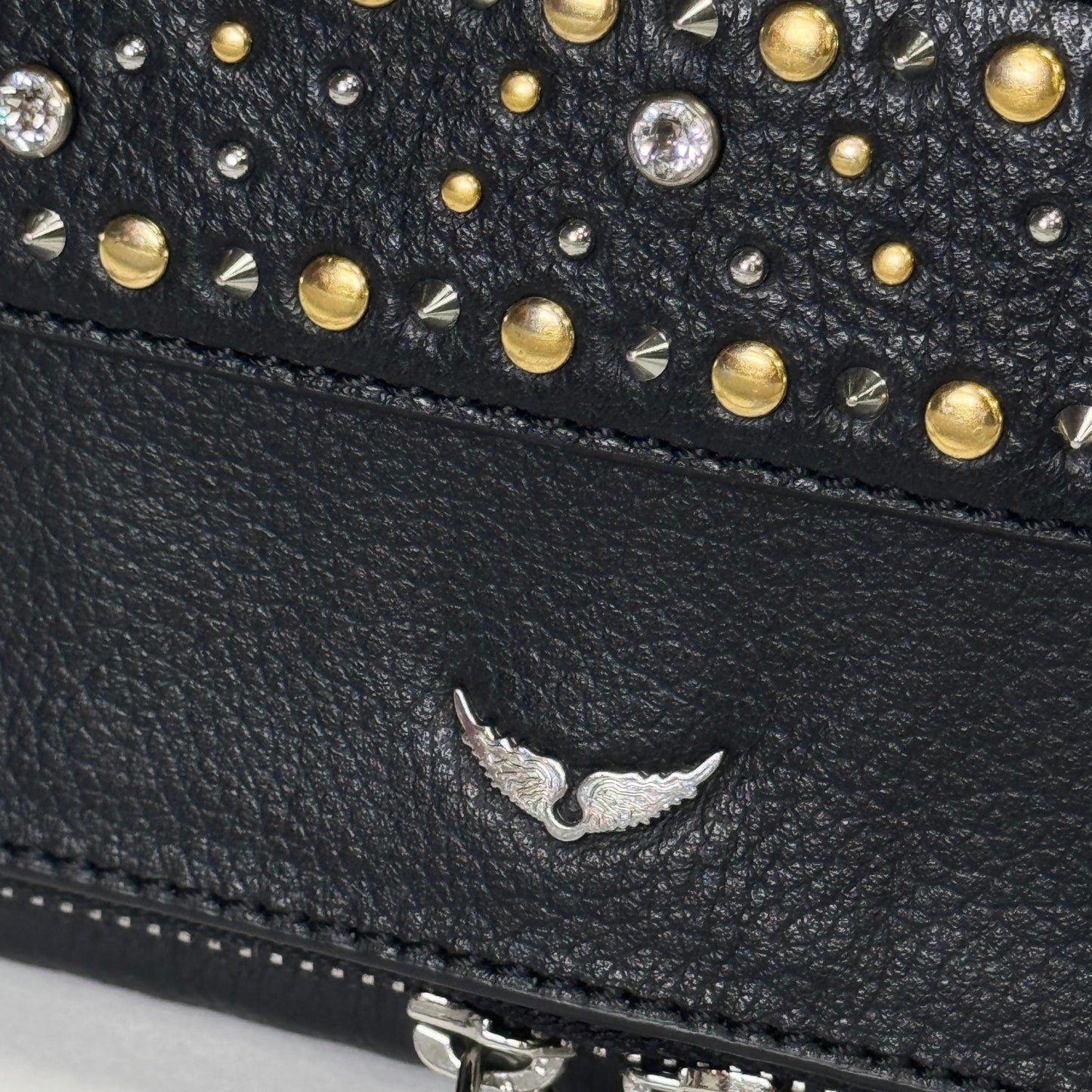 Rock leather clutch bag with studs