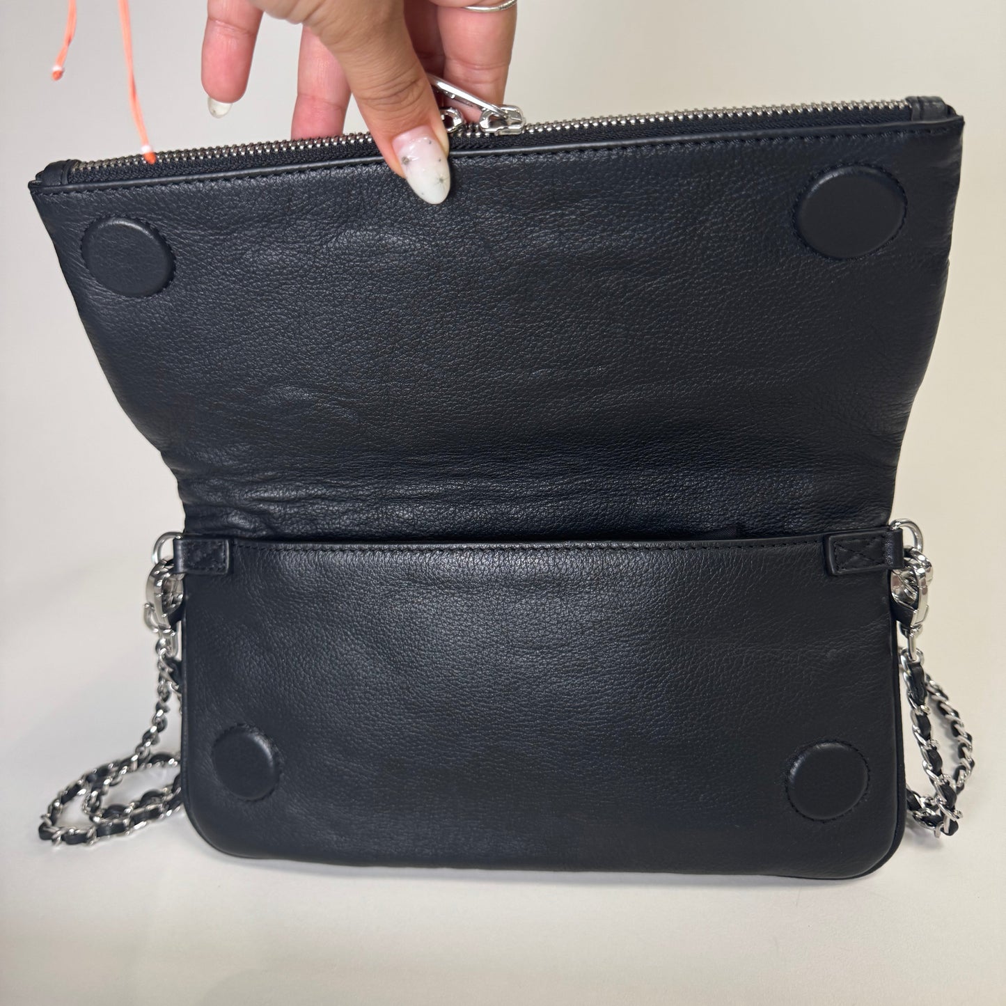 Rock leather clutch bag with studs