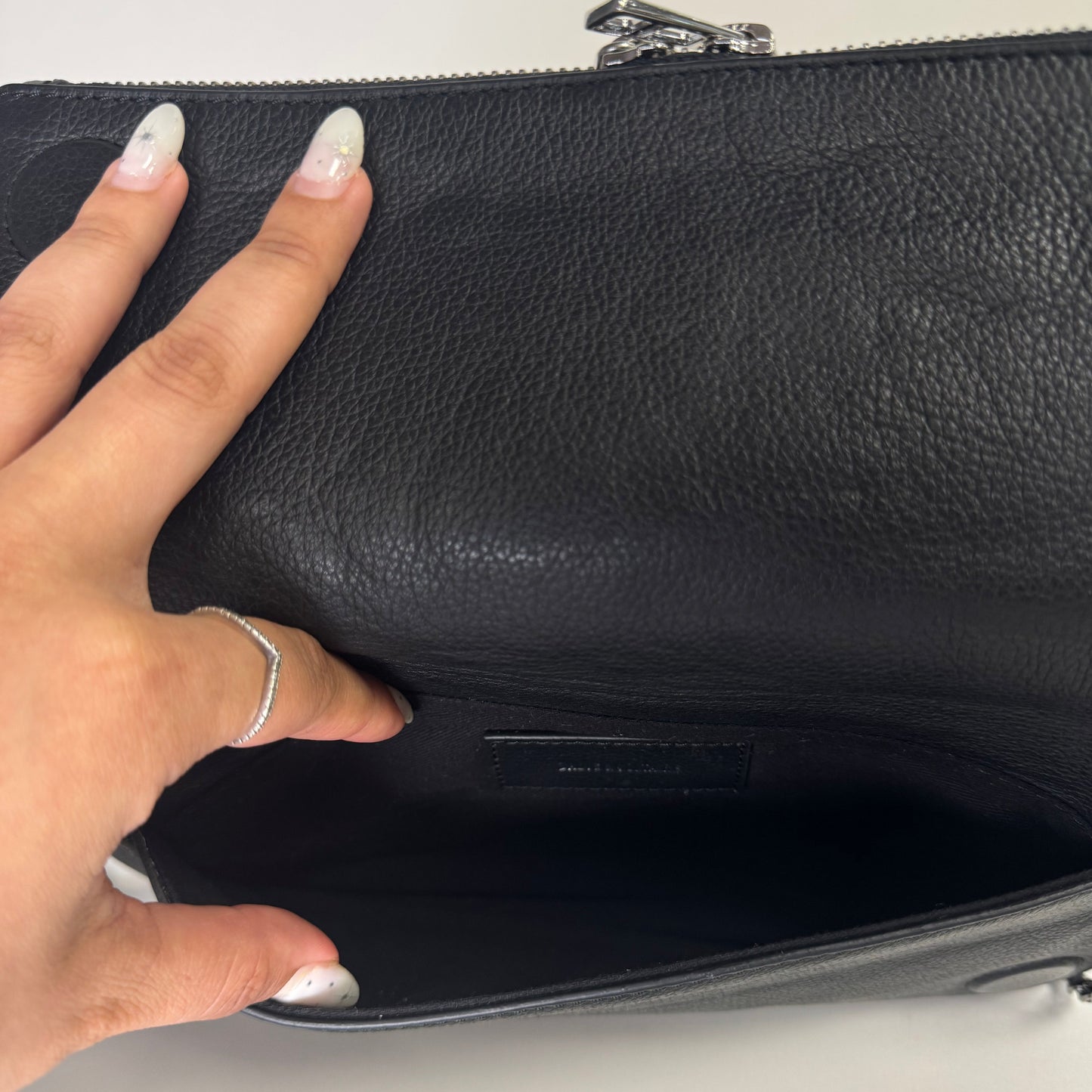 Rock leather clutch bag with studs