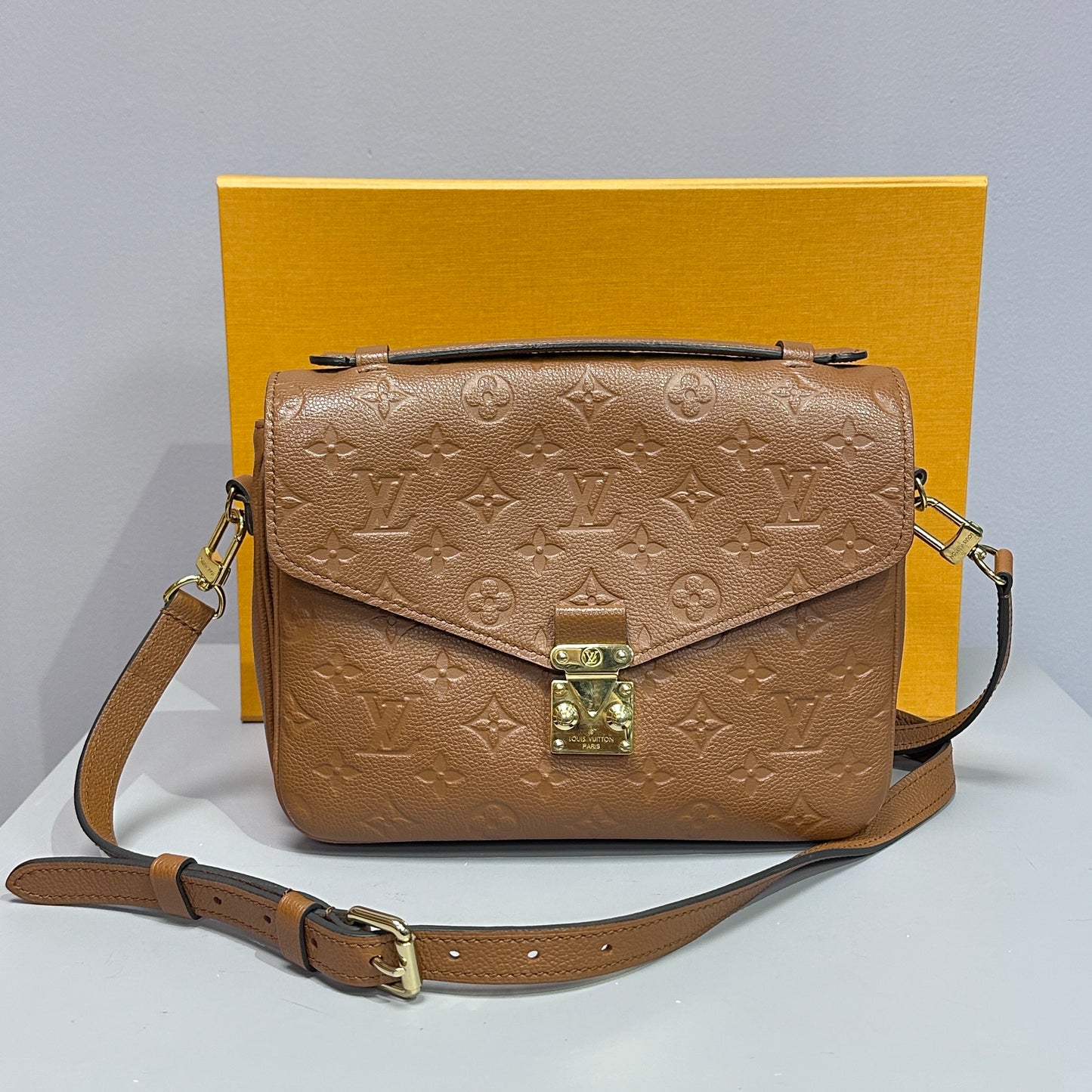 Louis Vuitton Pochette Metis Empreinte Leather Cognac