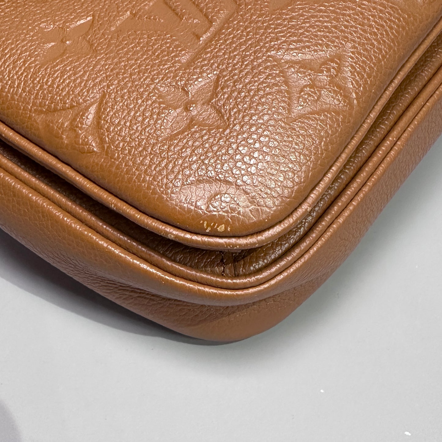 Louis Vuitton Pochette Metis Empreinte Leather Cognac